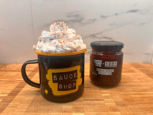 a picture of hot chocolate with whipped cream on it, with the Scotch Bonnet Chilli Jam jar next to it