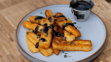 Crispy Halloumi Fries Drizzled In Holy Fire Hot Honey 