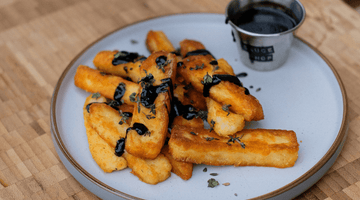 Crispy Halloumi Fries Drizzled In Holy Fire Hot Honey 
