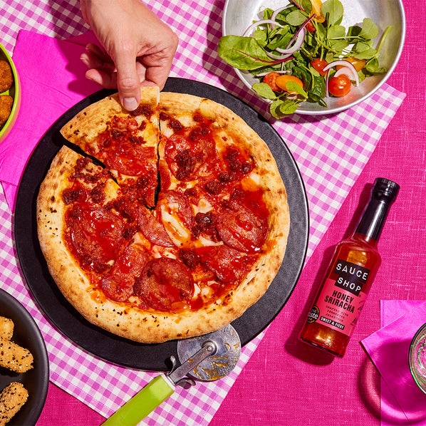Sauce Shop Honey Sriracha on Pepperoni Pizza serves with salad 