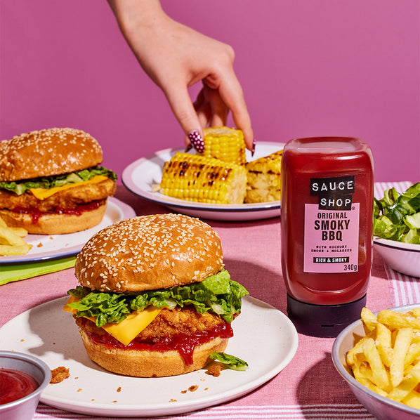 Sauce Shop Original Smoky BBQ Sauce in a Crispy Chicken Burger with Cheese and Lettuce. Side Servings of Corn on the COB, Salad and Fries
